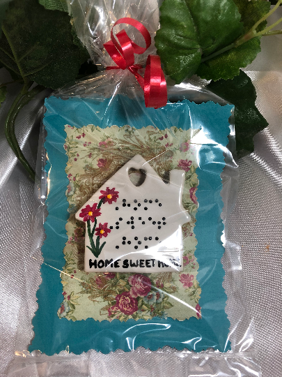 Packaged magnet with whimsical background and wrapped in celophane and bow- ready to give as a gift!